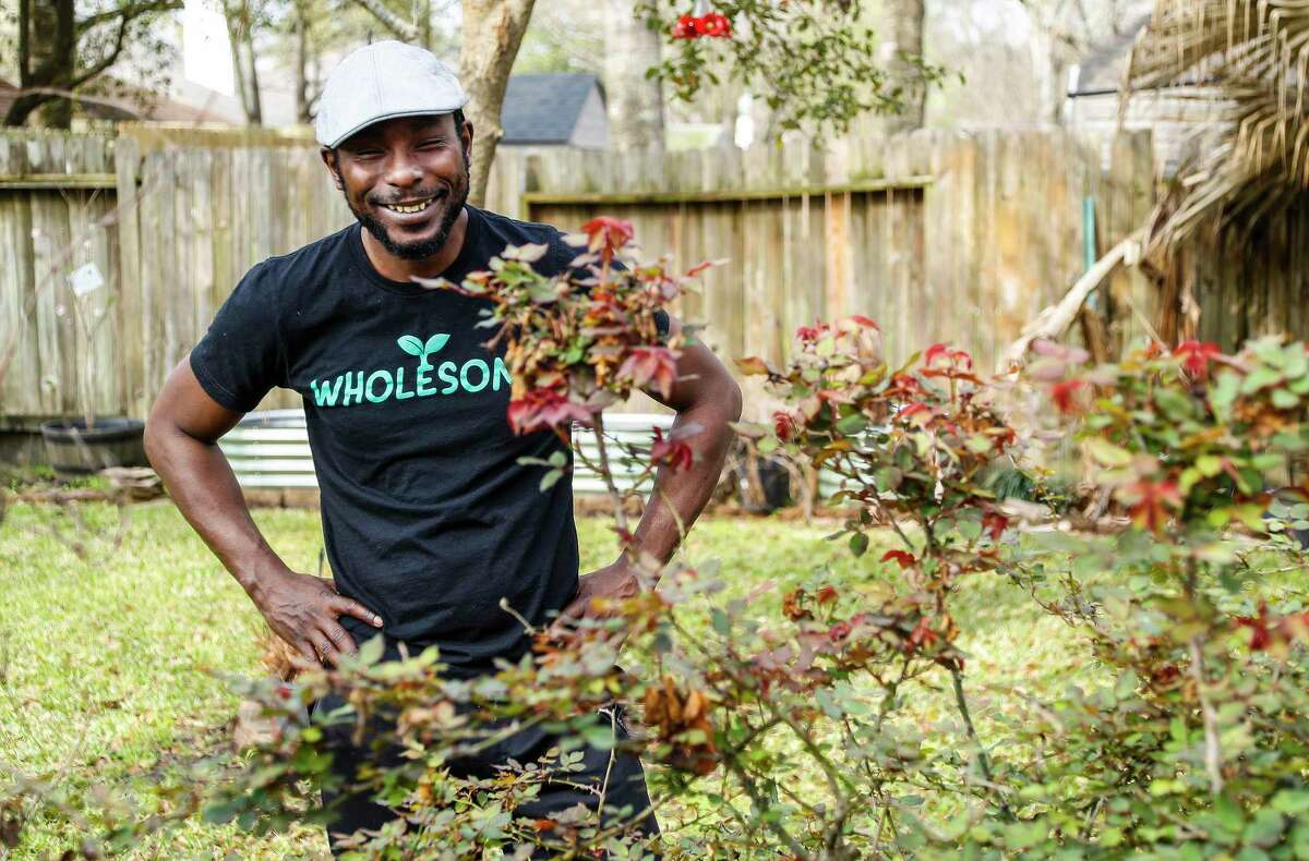 Marcus Bridgewater, also known as Garden Marcus, works with his rose bushes, which are budding out after the winter blast, in his backyard in Spring. Marcus’ garden videos filled with positivity and good vibes have gained him a TikTok following.