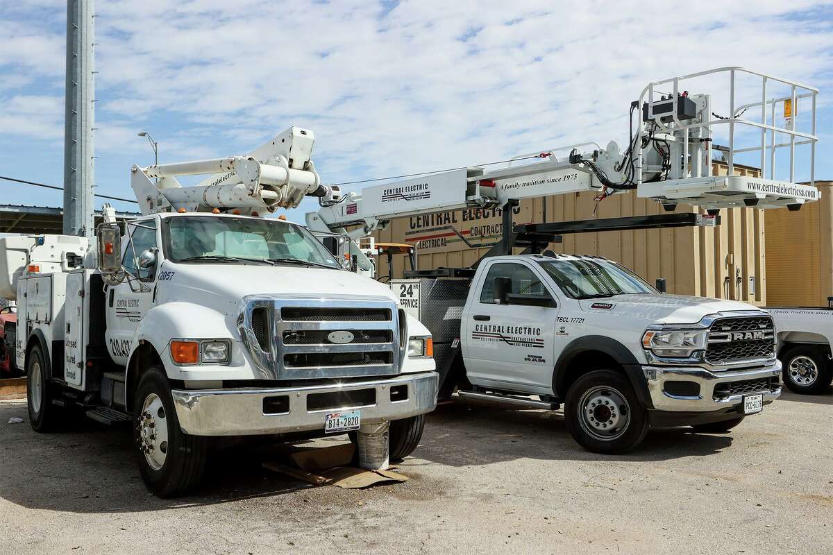 Work trucks in the parking lot of Central Electric, which was founded in 1975.