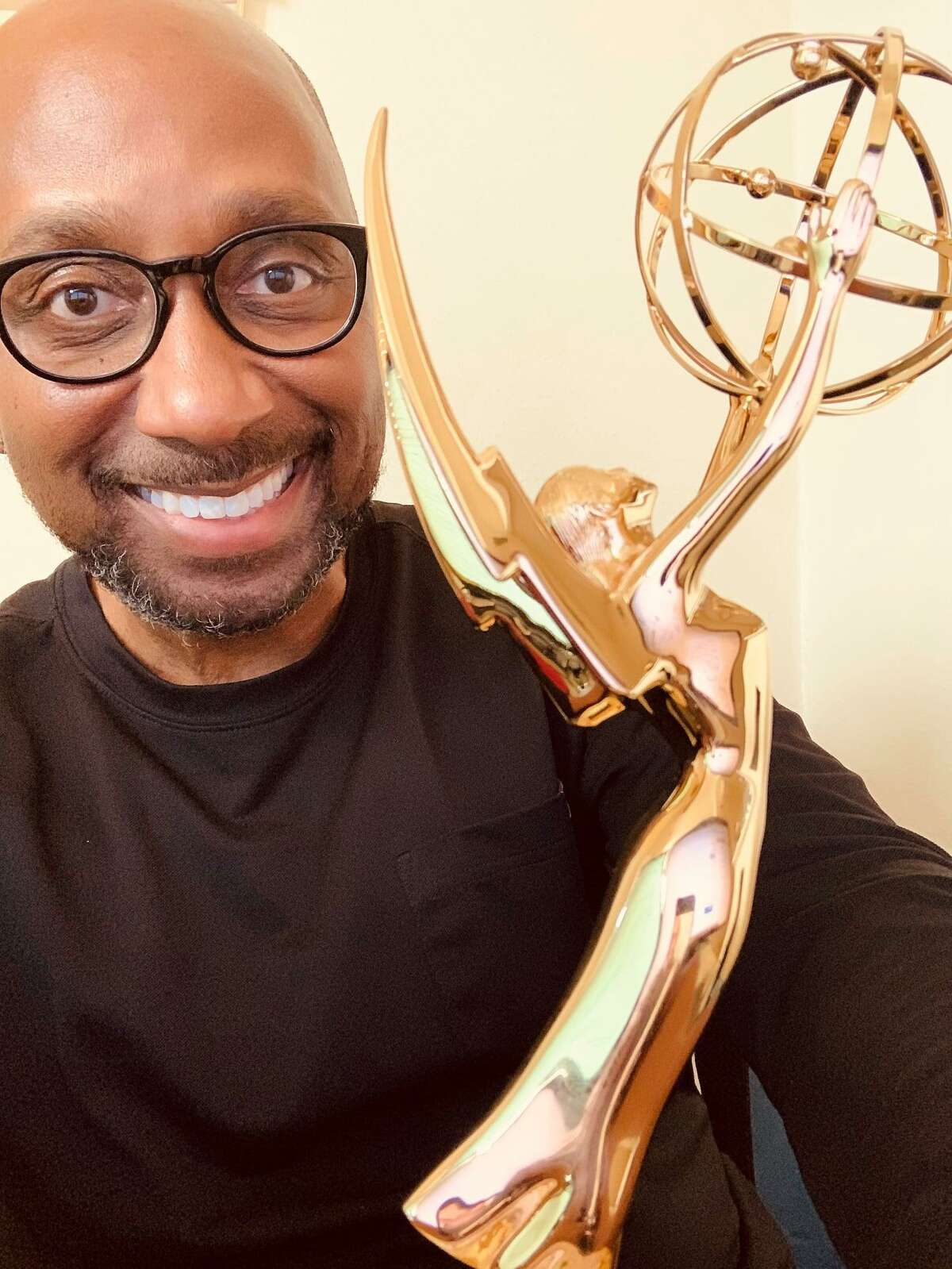 KENS 5 reporter Marvin Hurst poses with one of his two regional Emmy awards