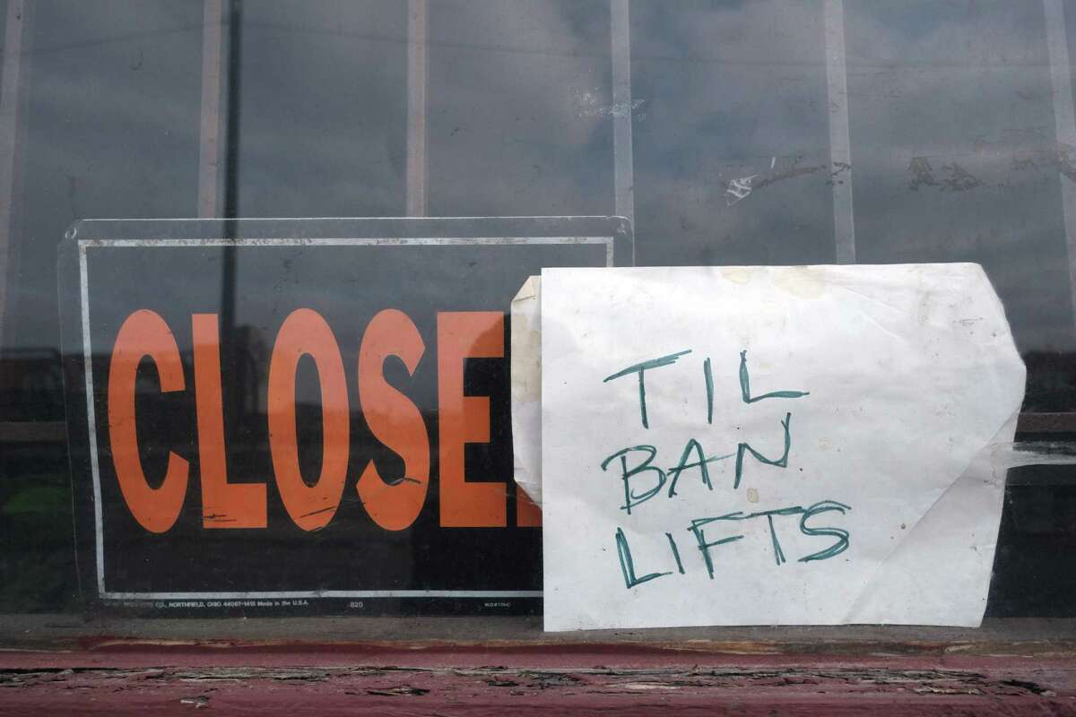 In this file photo taken on March 24, 2020, a local business is closed until the state sanctioned three weeks