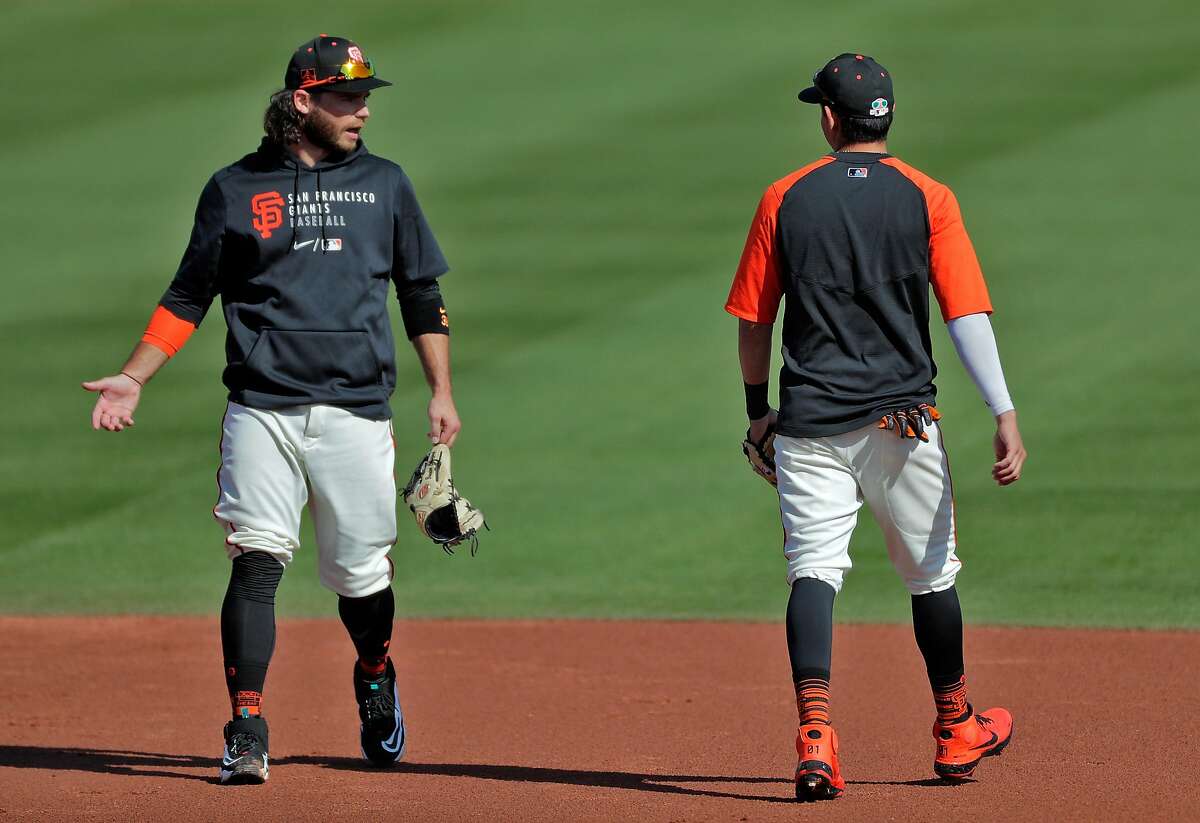 Brandon Crawford can often be seen chatting with Mauricio Dubón, who often is in Crawford’s group during practice.