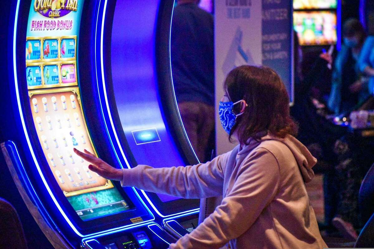 A gambler uses a video gaming machine at Foxwoods Resort Casino in Connecticut.