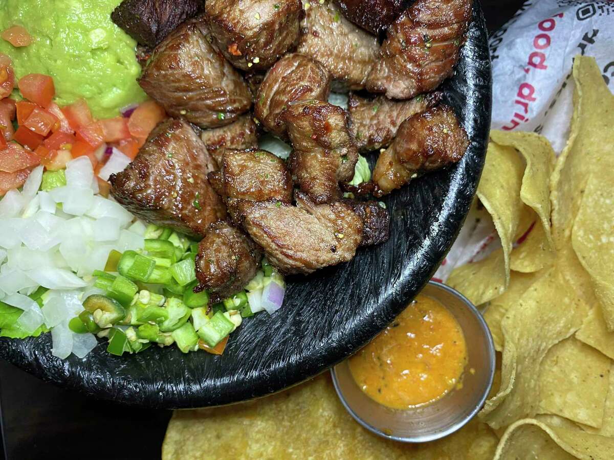 Chicharrón de rib-eye is fried steak served with guacamole, pico de gallo and tortillas at Cervecería 88 sports bar and Mexican restaurant.
