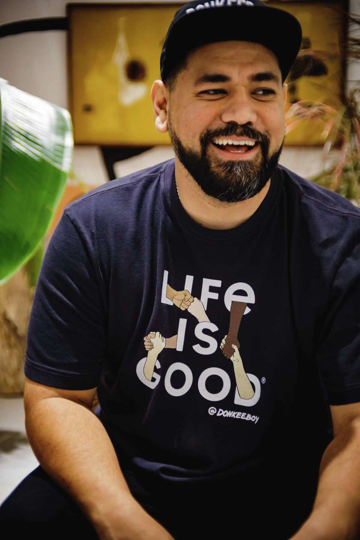 Houston artist Alex Roman designed a line of t-shirts for lifestyle brand Life is Good.