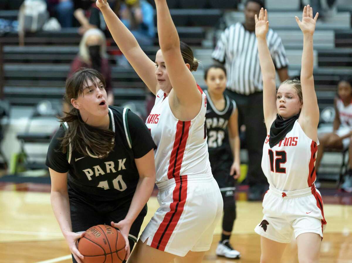 Kingwood Park guard Melina Merritt (10) shoots for the basket while blocked off by Porter forward Angelina Khalaf (25) during the second quarter of a District 20-5A girls basketball game at Porter High School, Saturday, Feb. 6, 2021 in Porter.