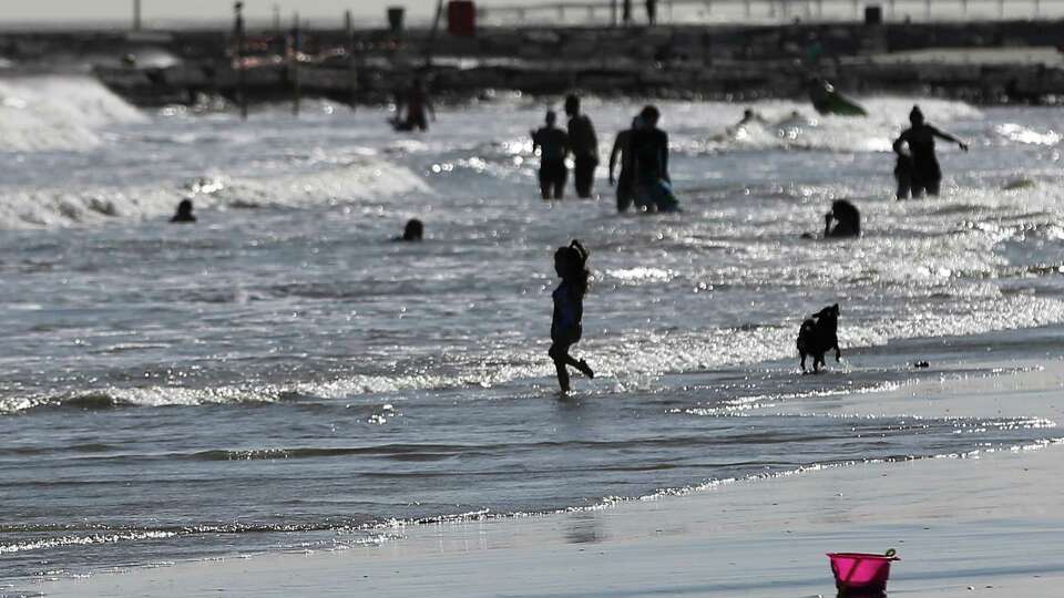 Beachgoers enjoy Galveston Beach during spring break on Wednesday, March 17, 2021.