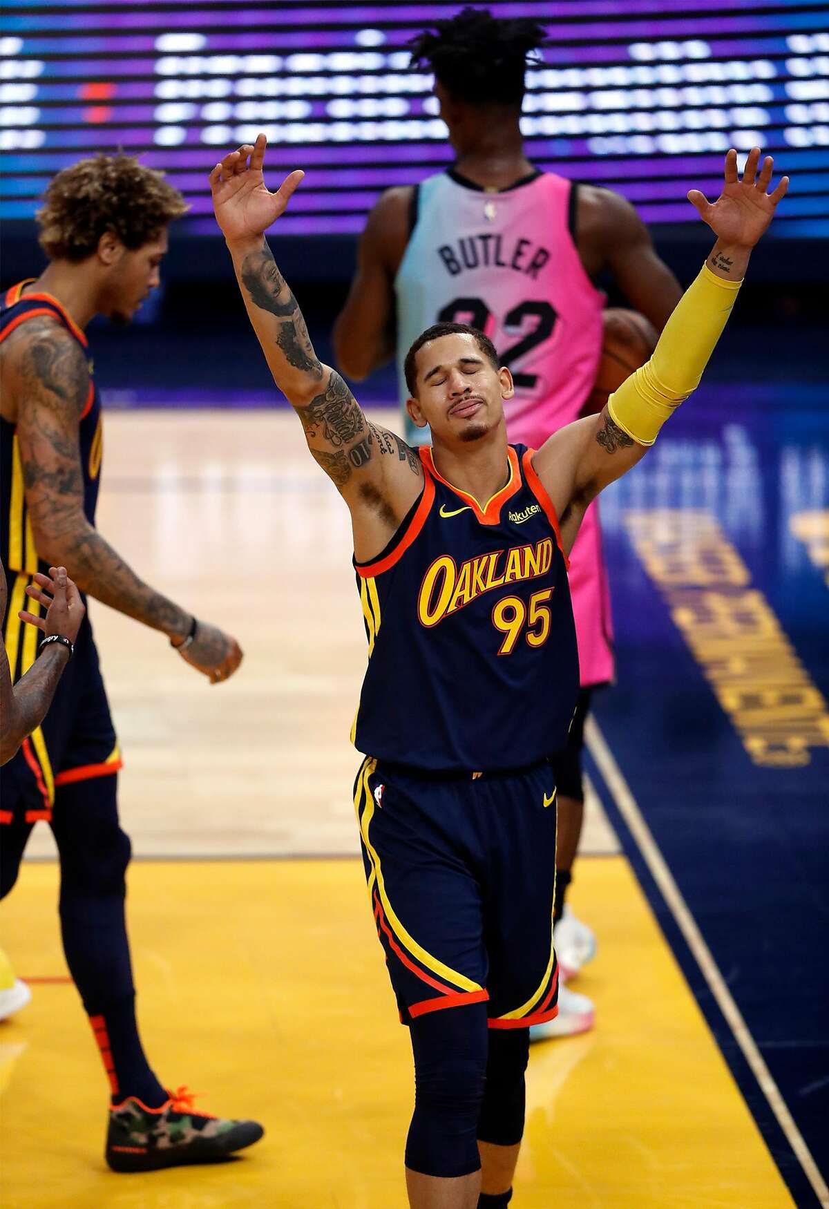 Golden State Warriors' Juan Toscano-Anderson disputes fouling Miami Heat's Jimmy Butler in 1st quarter during NBA, basketball game at Chase Center in San Francisco, Calif., on Wednesday, February 17, 2021.