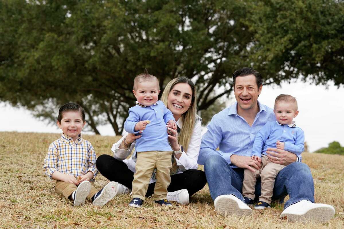 Blanca Lozano and her husband, Jorge Gomez, with their sons, Jorge, 3, left, and one-year-old twins, Santiago and Marcello, right, are shown Wednesday, Feb. 24, 2021 in Houston. Santiago was born with hypoplastic left heart syndrome, a severe congenital heart defect in which the left side of the heart is underdeveloped. He now has a fully functioning heart thanks to UTHealth physicians at Children’s Memorial Hermann.