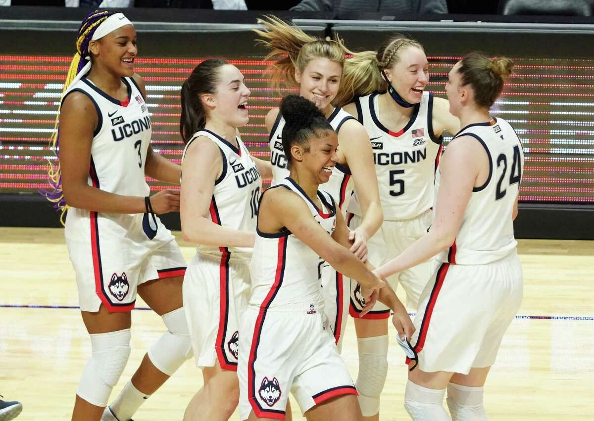 Mar 8, 2021; Uncasville, Connecticut, USA; The UConn Huskies celebrate after defeating the Marquette Golden Eagles in the Big East Championship game at Mohegan Sun. Mandatory Credit: David Butler II-USA TODAY Sports