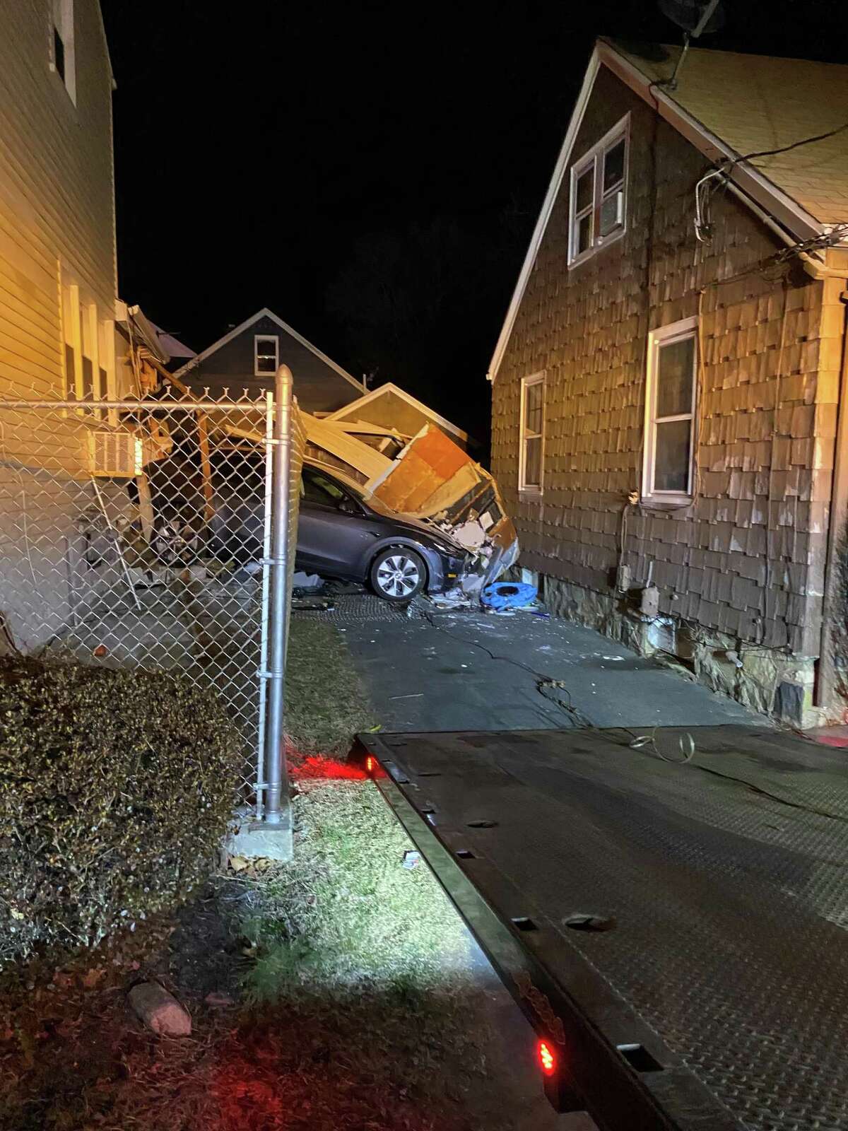 Car crashes through Trumbull garage