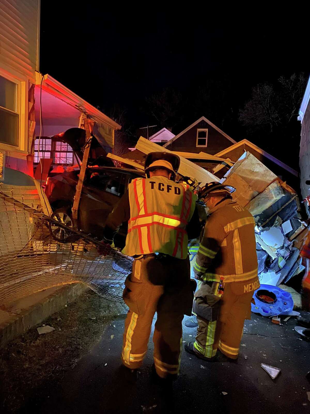 Car crashes through Trumbull garage