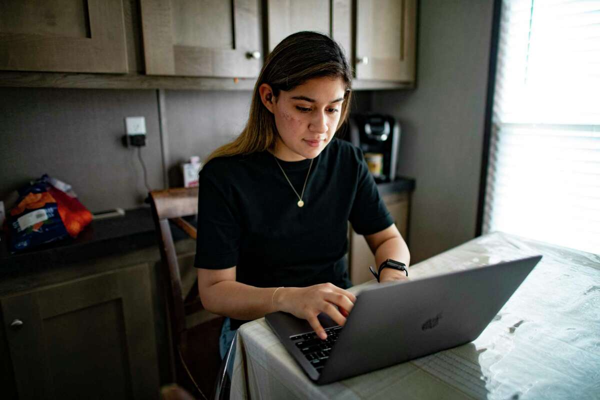 Miriam Perez, who is a DACA applicant, looks over her Texas A&M-San Antonio online lessons on Wednesday, Feb. 24, 2021.