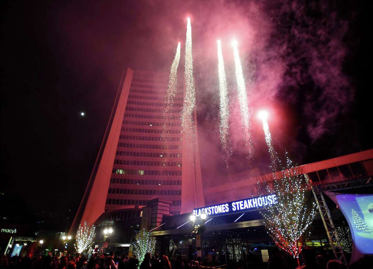 Fireworks are launched above Broad Street and the Landmark Building in Stamford, Conn. as part of the Heights & Lights celebration on Sunday, December 8, 2019.