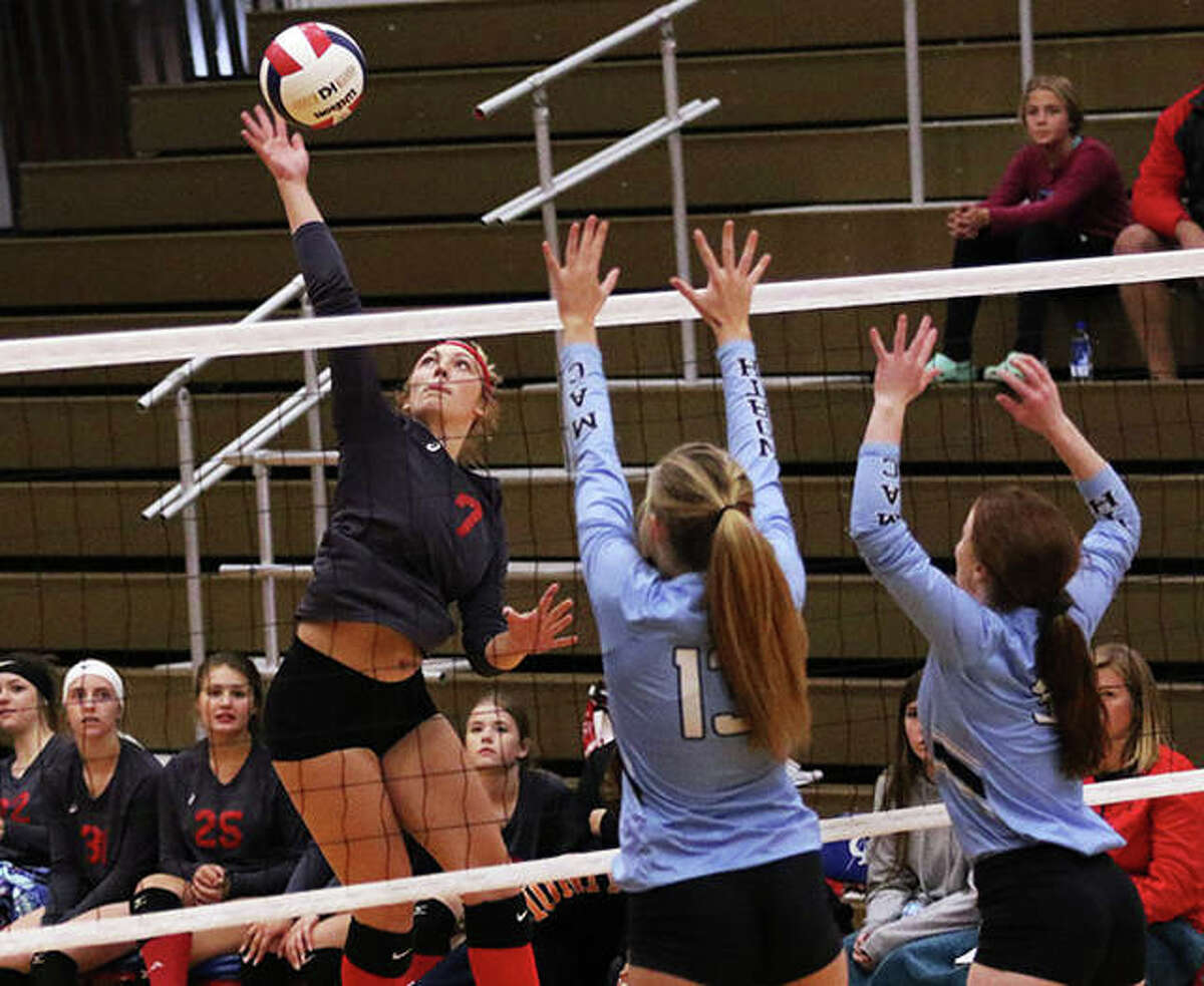 Staunton’s Haris Legendre (left), shown hitting in a Macoupin County Tourney match against North Mac last season in Carlinville, had 13 kills Thursday night in the Bulldogs’ SCC victory over Pana. Staunton halted Pana’s SCC win streak at 28 in a row.