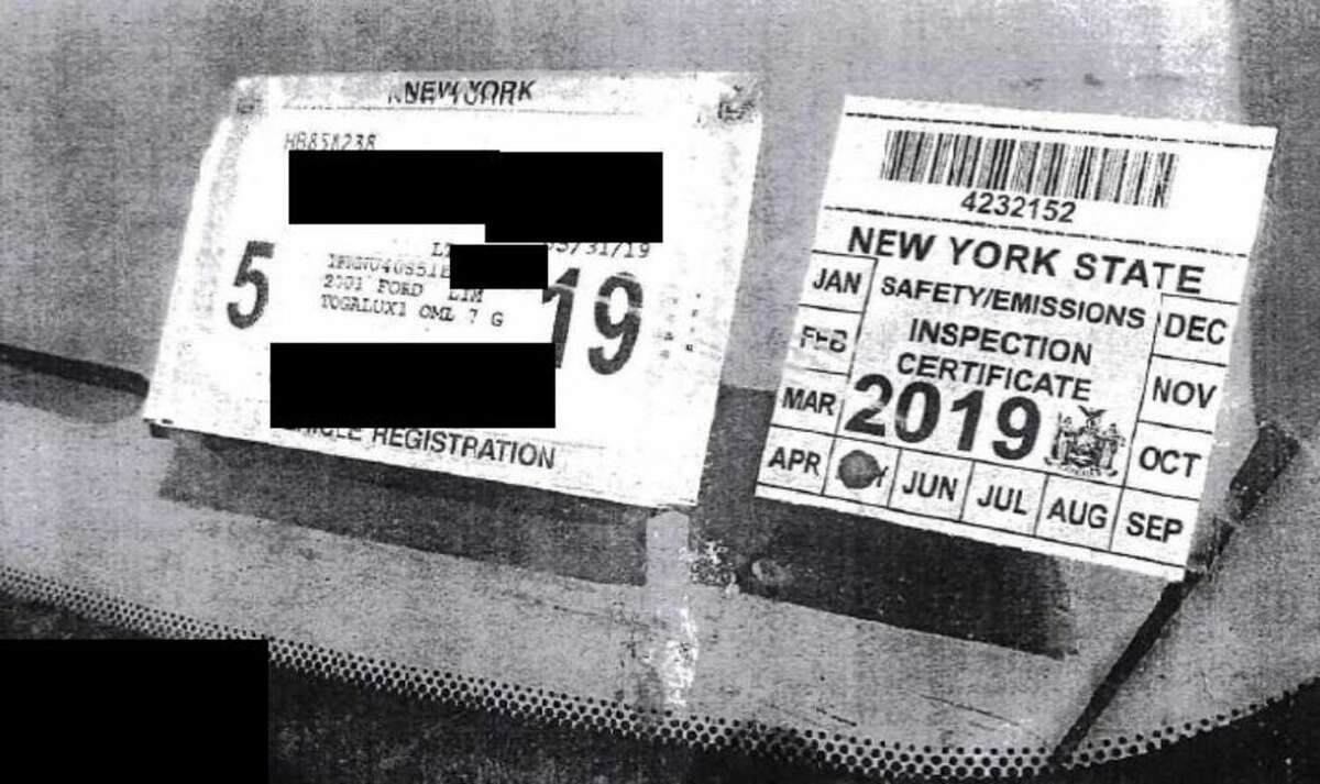 A photo of the DMV inspection sticker issued by Mavis to Nauman Hussain in May of 2018 for his stretch Excursion limo, along with the DMV registration sticker. The NTSB says Hussain should not have been able to receive either under state law.