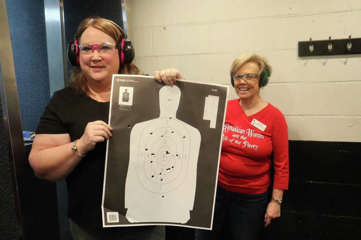 Members of North Shore Republican Women recently launched a new shooting group, called “Pistols & Pearls." Tracie de Roulac shows off her target while Karen Darcy-Pawlak looks on.
