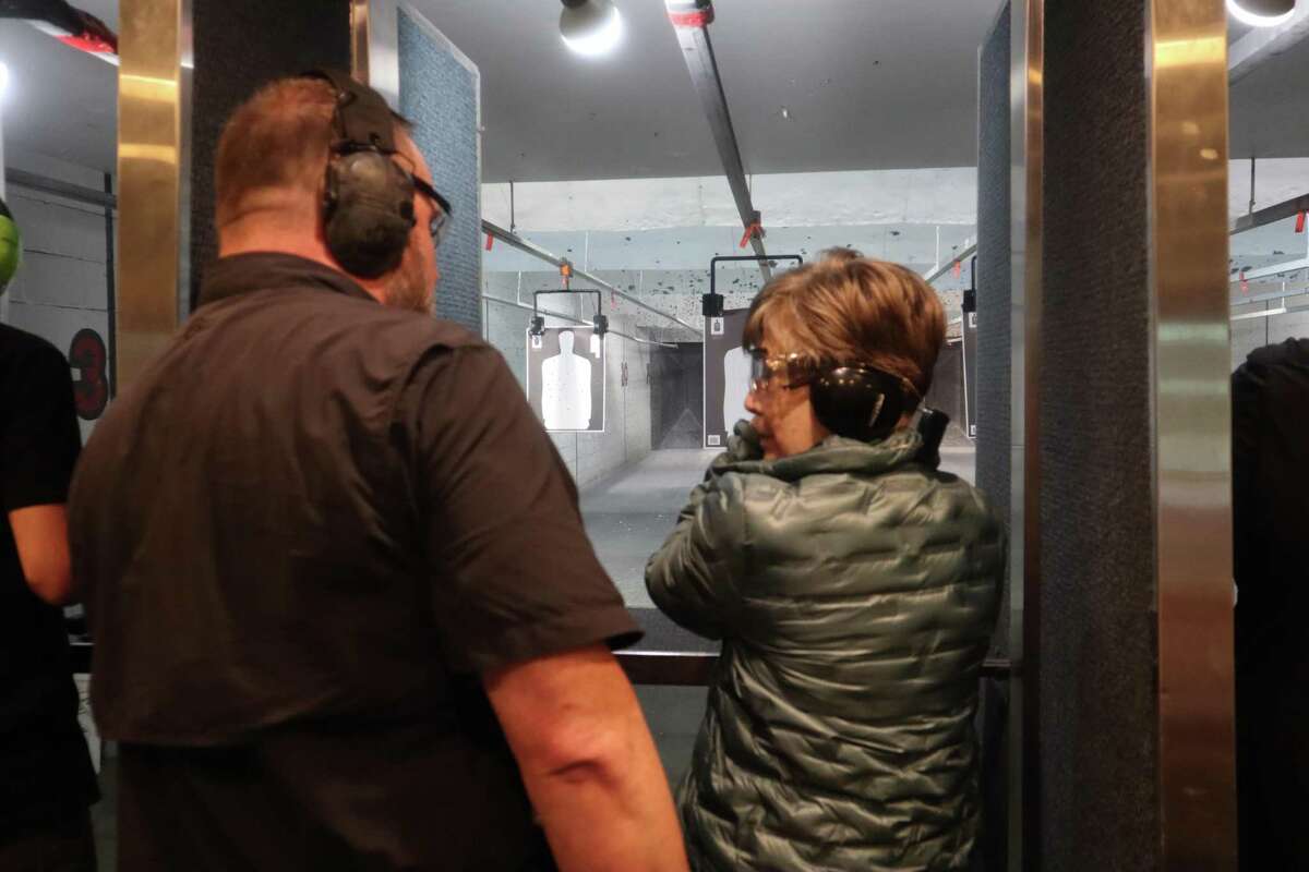 Members of North Shore Republican Women recently launched a new shooting group, called “Pistols & Pearls." Instructor Doug Johnson helps out Shirley Burg.