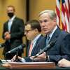 Gov. Greg Abbott talks to reporters during a press conference about a package of election reforms, at Senator Paul Bettencourt's District Office on Monday, March 15, 2021, in Houston.