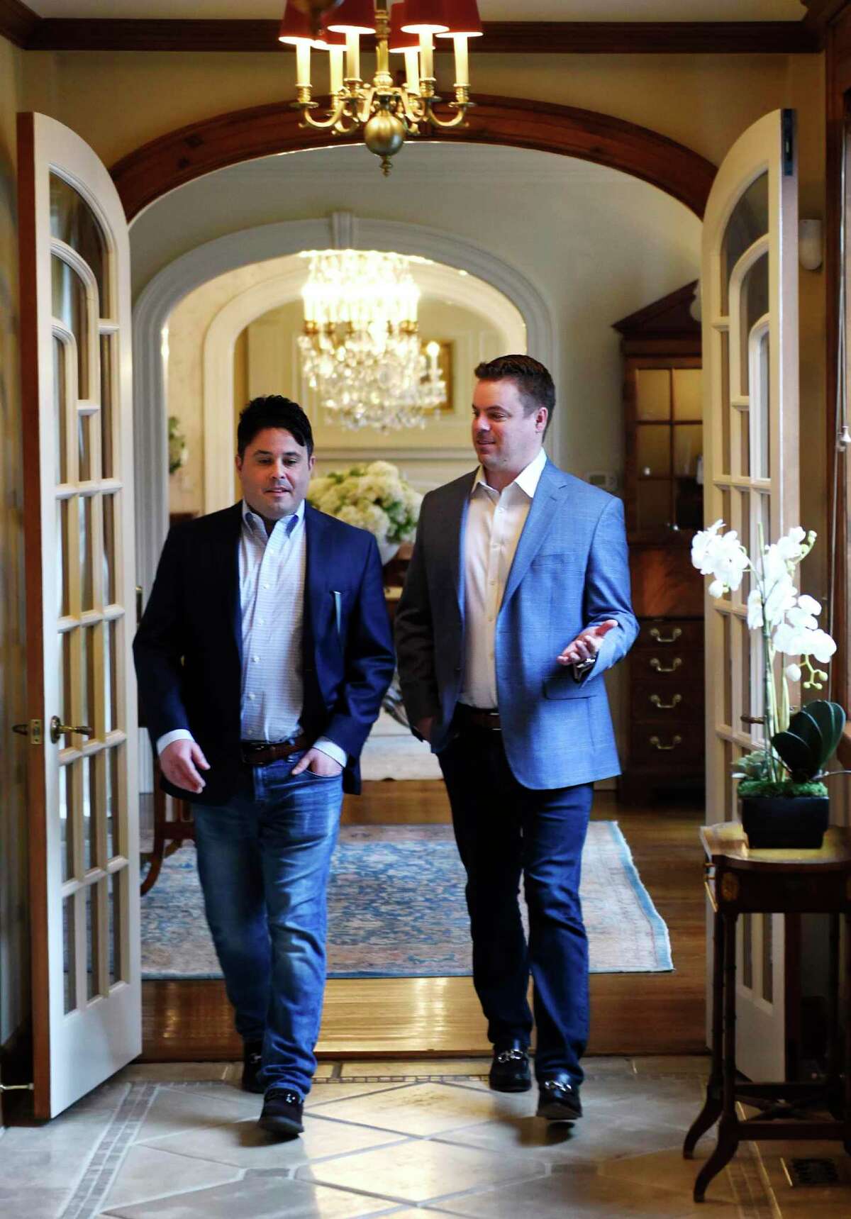 The Agency New Canaan Managing Partners Todd David Miller, left, and Cliff Smith walk through a residential listing in New Canaan, Conn. Thursday, March 18, 2021. Former Higgins Group real estate agents Cliff Smith and Todd David Miller aligned with global luxury real estate firm The Agency. The Agency New Canaan is the group's first Connecticut franchise.