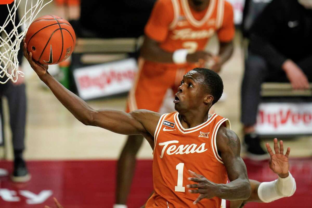 Texas guard Andrew Jones drives to the basket during the second half of an NCAA college basketball game against Iowa State, Tuesday, March 2, 2021, in Ames, Iowa. Texas won 81-67. (AP Photo/Charlie Neibergall)