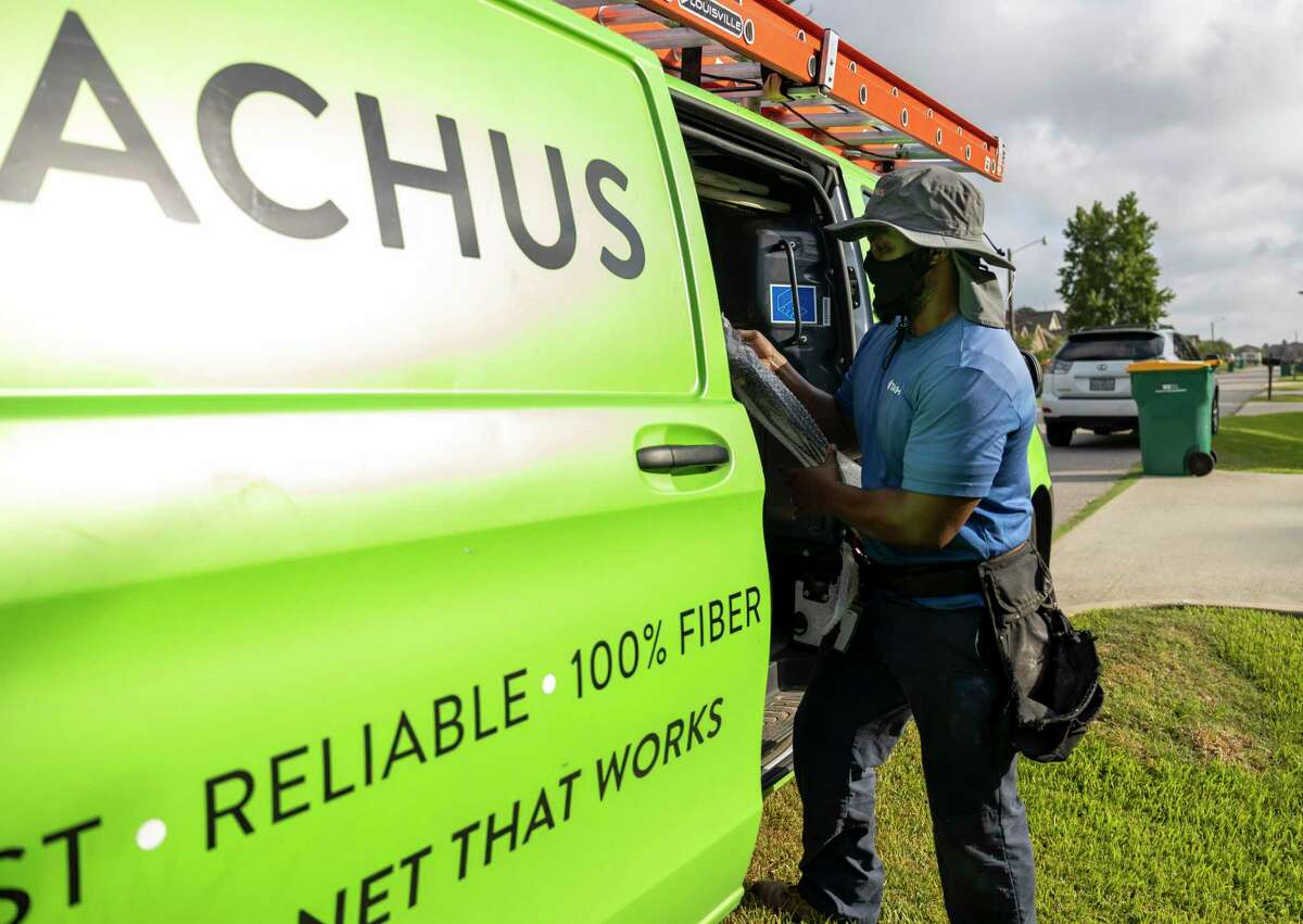 A field service technician with Tachus Fiber Internet works in The Woodlands. The firm has been installing high-speed fiber optic cable around the region for the past several years.