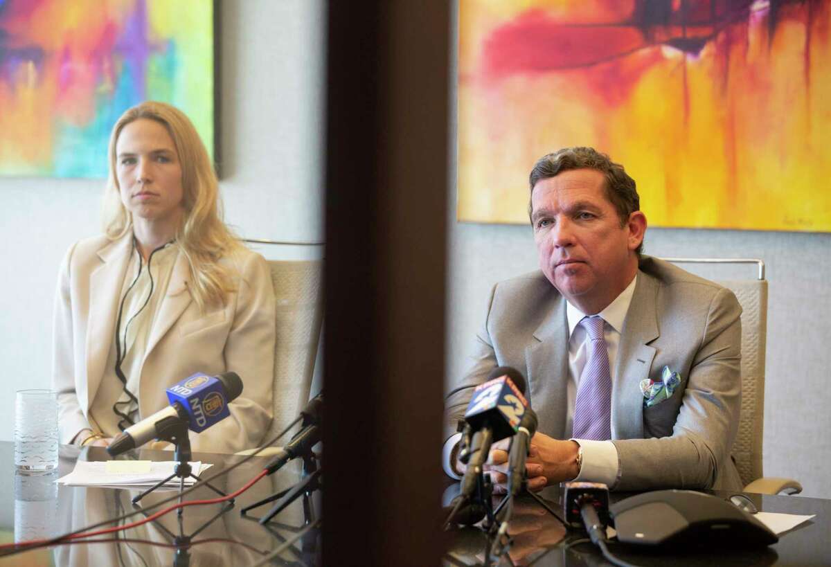 Attorney Tony Buzbee and associate, Cornelia Brandfield-Harvey, whom Buzbee said has been working a lot on the Deshaun Watson law suits, are photographed during a press conference Friday, March 19, 2021, in Houston. Buzbee said his firm will file total of 12 civil cases against Watson, the Houston Texans quarterback, accusing him of sexual assault. He said seven cases have been filed and five more will be filed soon.