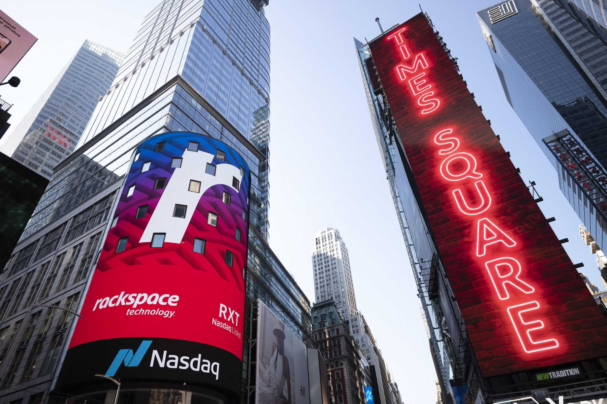 Cloud computing company Rackspace begins trading at the Nasdaq following its initial public offering, Wednesday, Aug. 5, 2020, in New York's Times Squ
