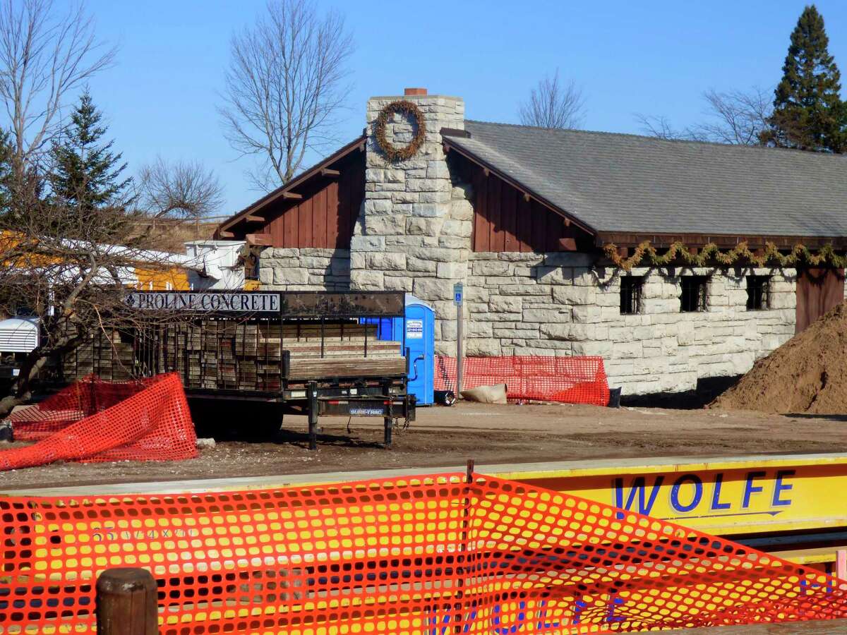 Work crews set the shelter house into the foundation at its new location in Orchard Beach State Park in late 2020. 