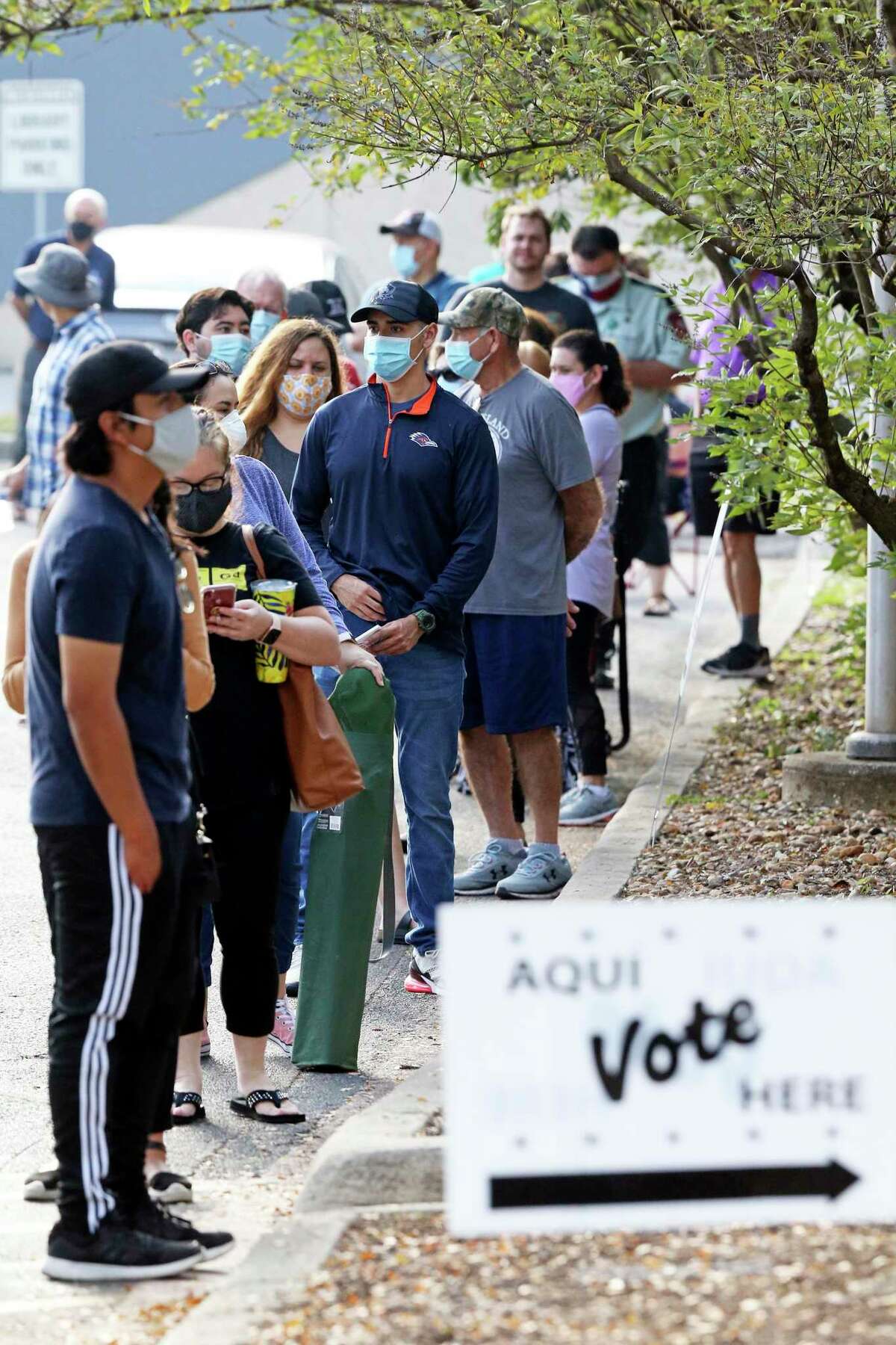 Voters wait in a long line at Brookhollow Library in October. After a secure election that saw record turnout, Republicans across the nation, including in Texas, are pushing efforts to limit ballot access.