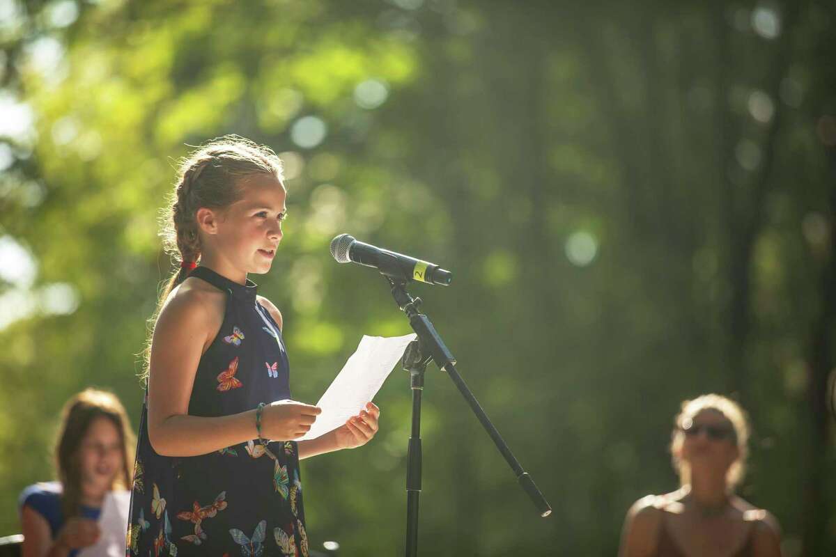 A top selected Young Writer performs her piece at 2019’s 5 Senses Festival in Washington.