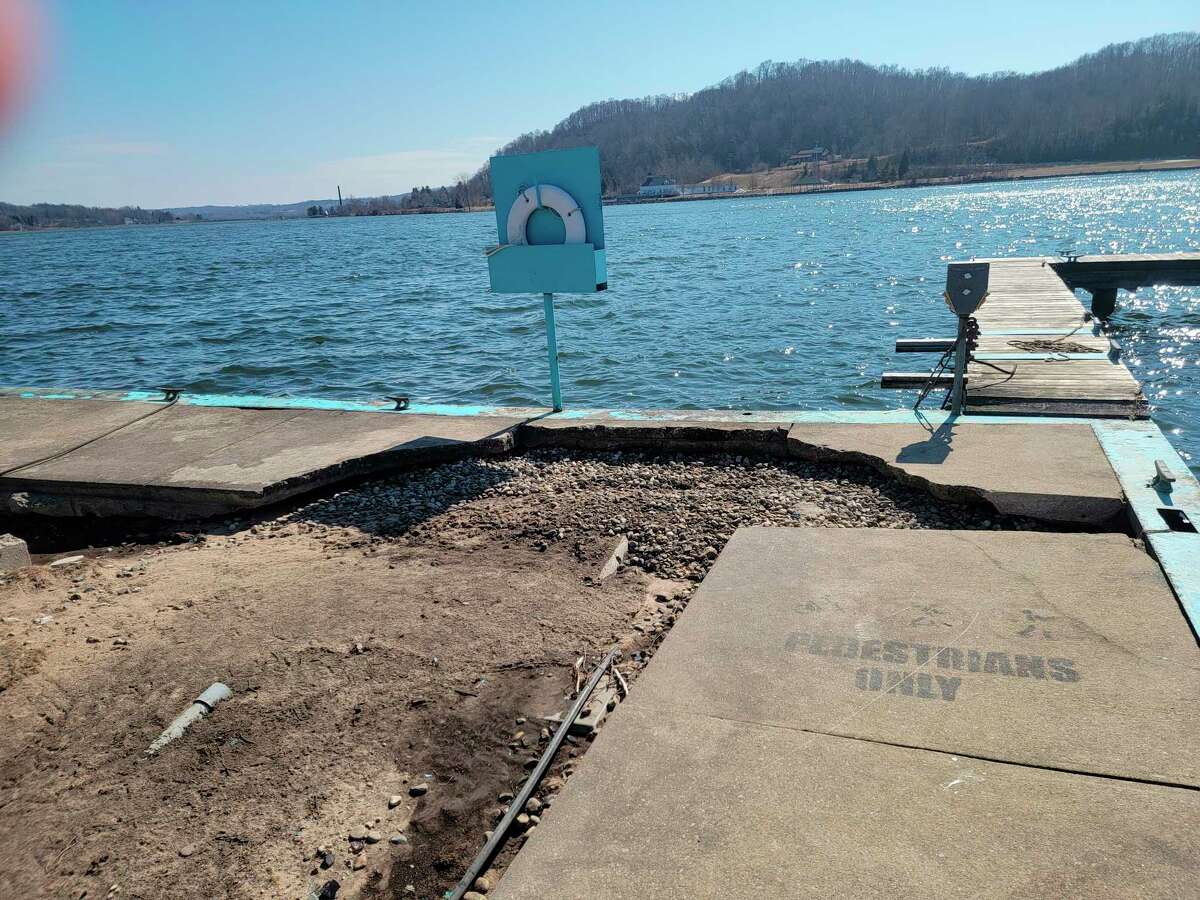 The walkway along the pier at Frankfort's municipal marina was damage by high waters and wave action eroding the ground beneath it. (Colin Merry/Record Patriot)