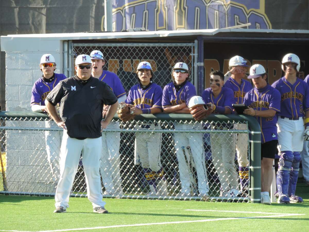 Midland High head coach Jeremy Mueller and Bulldogs players look on during a March 19 baseball game against San Angelo Central at Zachery Field.