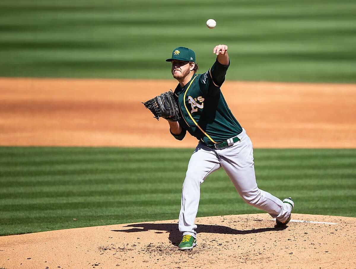 SCOTTSDALE, AZ - MARCH 03: Cole Irvin #71of the Oakland Athletics pitches during a spring training game against the Colorado Rockies at Salt River Field on March 3, 2021 in Scottsdale, Arizona. (Photo by Rob Tringali/Getty Images)