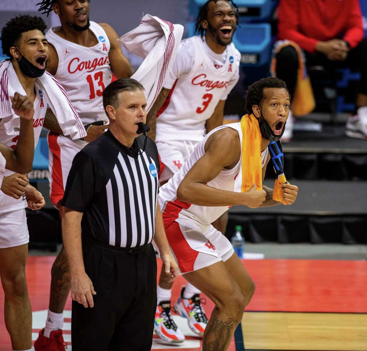 Houston forward Justin Gorham (4) reacts in the final moments of the second half of a first-round game against Cleveland State as they prepare to celebrate their win in the NCAA men's college basketball tournament, Friday, March 19, 2021, at Assembly Hall in Bloomington, Ind. (AP Photo/Doug McSchooler)