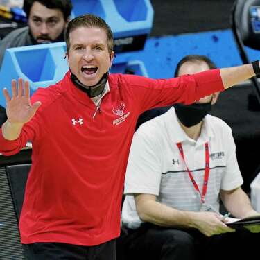 Hartford head coach John Gallagher yells to his players during the first half of a college basketball game against Baylor in the first round of the NCAA tournament at Lucas Oil Stadium in Indianapolis Friday, March 19, 2021, in Indianapolis, Tenn. (AP Photo/Mark Humphrey)
