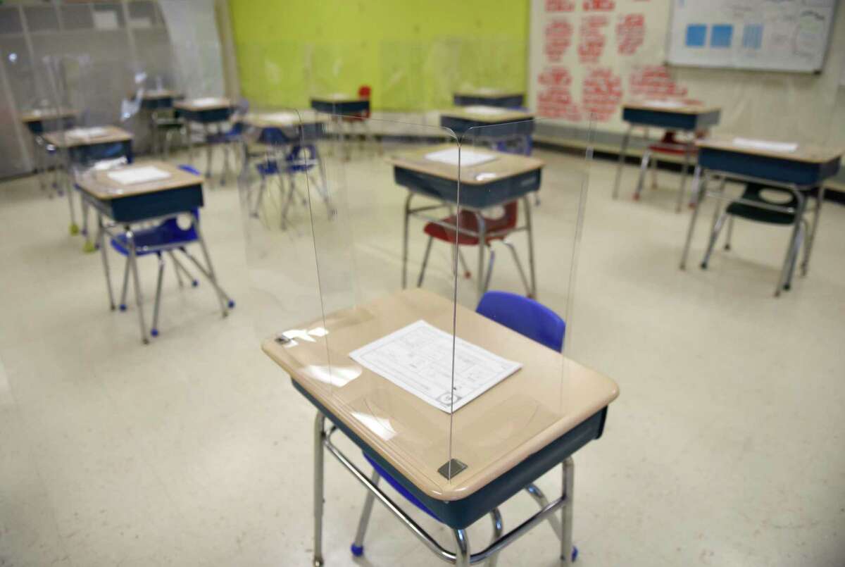 A classroom is set up with COVID-19 precautions in place at Northeast Elementary School in Stamford, Conn. Monday, March 8, 2021.