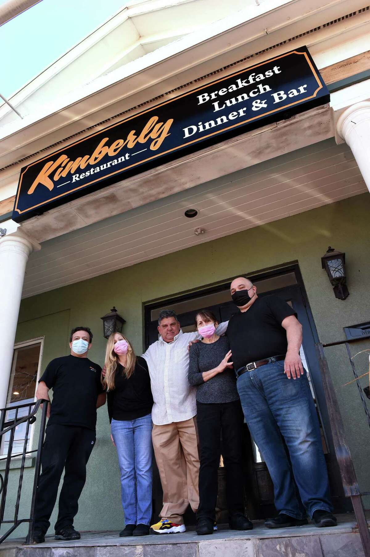 From left, chef Abraham Guney, Allison McNabb, builder Robert Altieri, Rena Tsopanides and her son, owner Timmy Tsopanides, photographed outside the Kimberly Restaurant in Milford March 19, 2021. The restaurant will reopen on Tuesday March 23rd following repairs from flood damage. Roberts Mechanical Services performed the renovations.