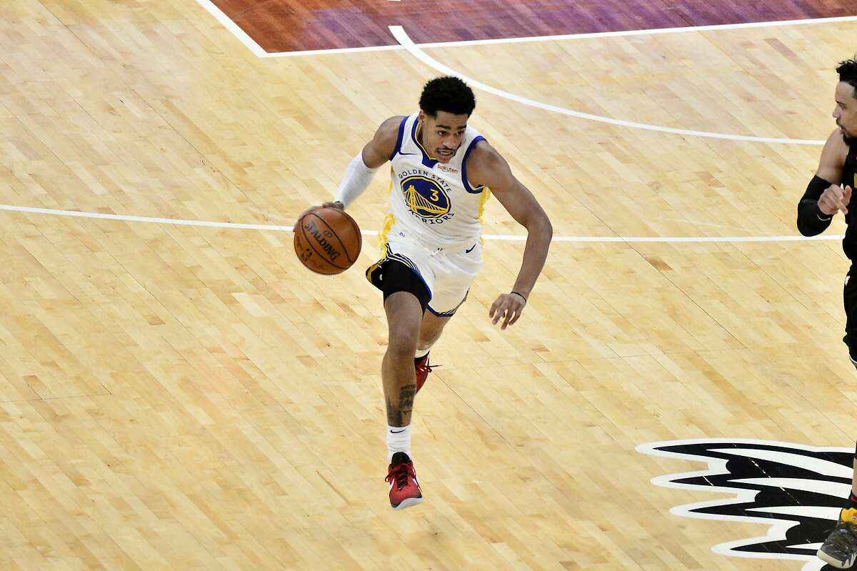 Golden State Warriors guard Jordan Poole (3) handles the ball in the second half of an NBA basketball game against the Memphis Grizzlies Friday, March 19, 2021, in Memphis, Tenn. (AP Photo/Brandon Dill)