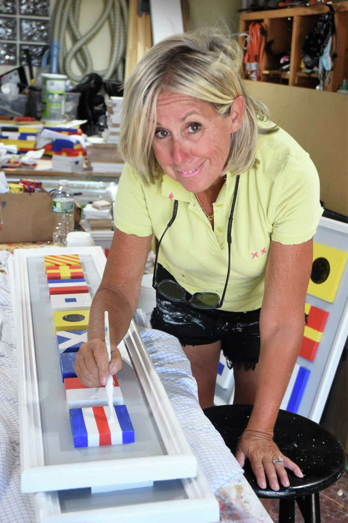 Pam Hadden Tomlin working in her garage studio.