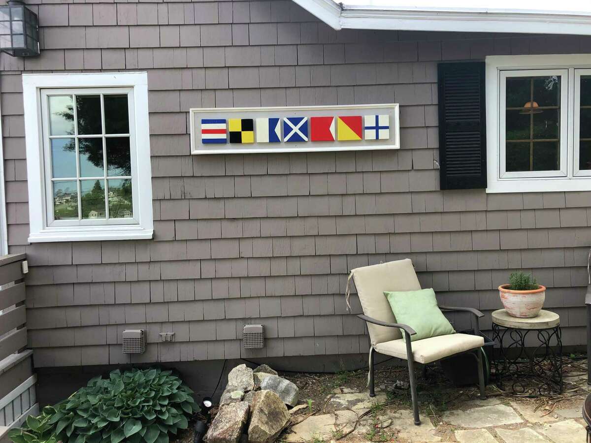 A house sign spells out “Clambox.”