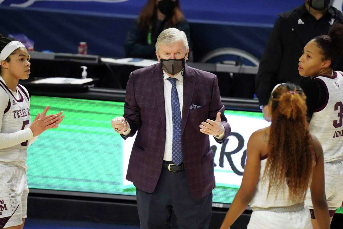 Texas A&M head coach Gary Blair greets players during a timeout in the first half of an NCAA college basketball game against LSU Friday, March 5, 2021, during the Southeastern Conference tournament in Greenville, S.C. (AP Photo/Sean Rayford)