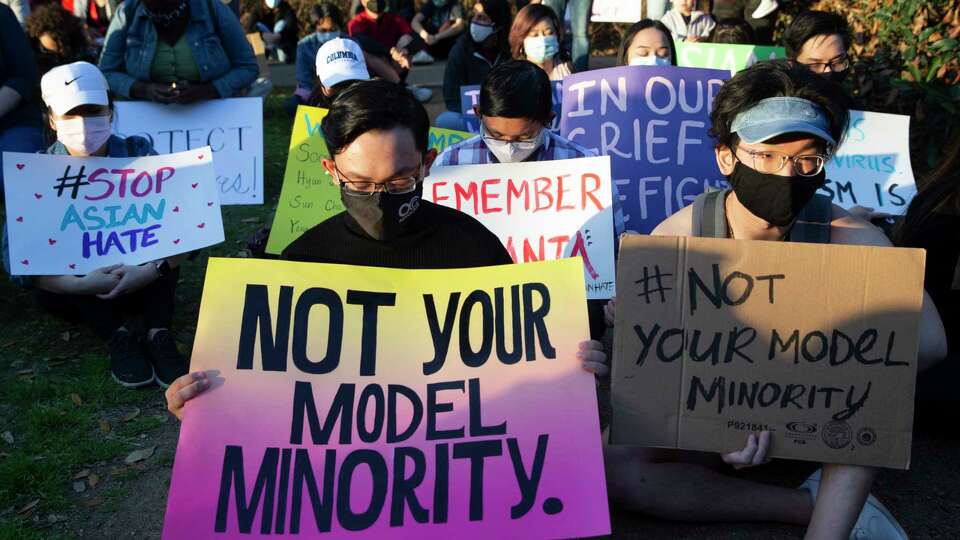 People take a moment of silence while participating a 'Stop Asian Hate Vigil & Rally' to mourn the six Asian American victims killed in Atlanta and denounce a rise in hate incidents and violence targeting Asian Americans Saturday, March 20, 2021, at Discovery Green in Houston.