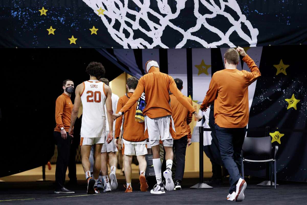 INDIANAPOLIS, INDIANA - MARCH 20: Texas Longhorns players walk off the court after losing to Abilene Christian Wildcats 53-52 in the first round game of the 2021 NCAA Men's Basketball Tournament at Lucas Oil Stadium on March 20, 2021 in Indianapolis, Indiana. (Photo by Jamie Squire/Getty Images)