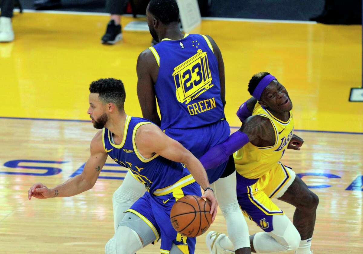 Draymond Green (23) sets a screen for Stephen Curry (30) in the first half as the Golden State Warriors played the Los Angeles Lakers at Chase Center in San Francisco, Calif., on Monday, March 15, 2021.