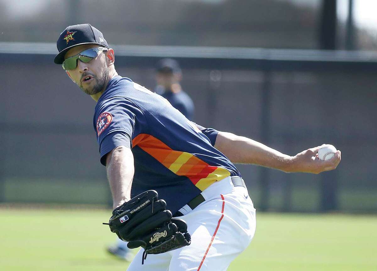 Houston Astros pitcher Steve Cishek (31) throws during spring training workouts for the Astros at Ballpark of the Palm Beaches in West Palm Beach, Florida, Thursday, February 25, 2021.