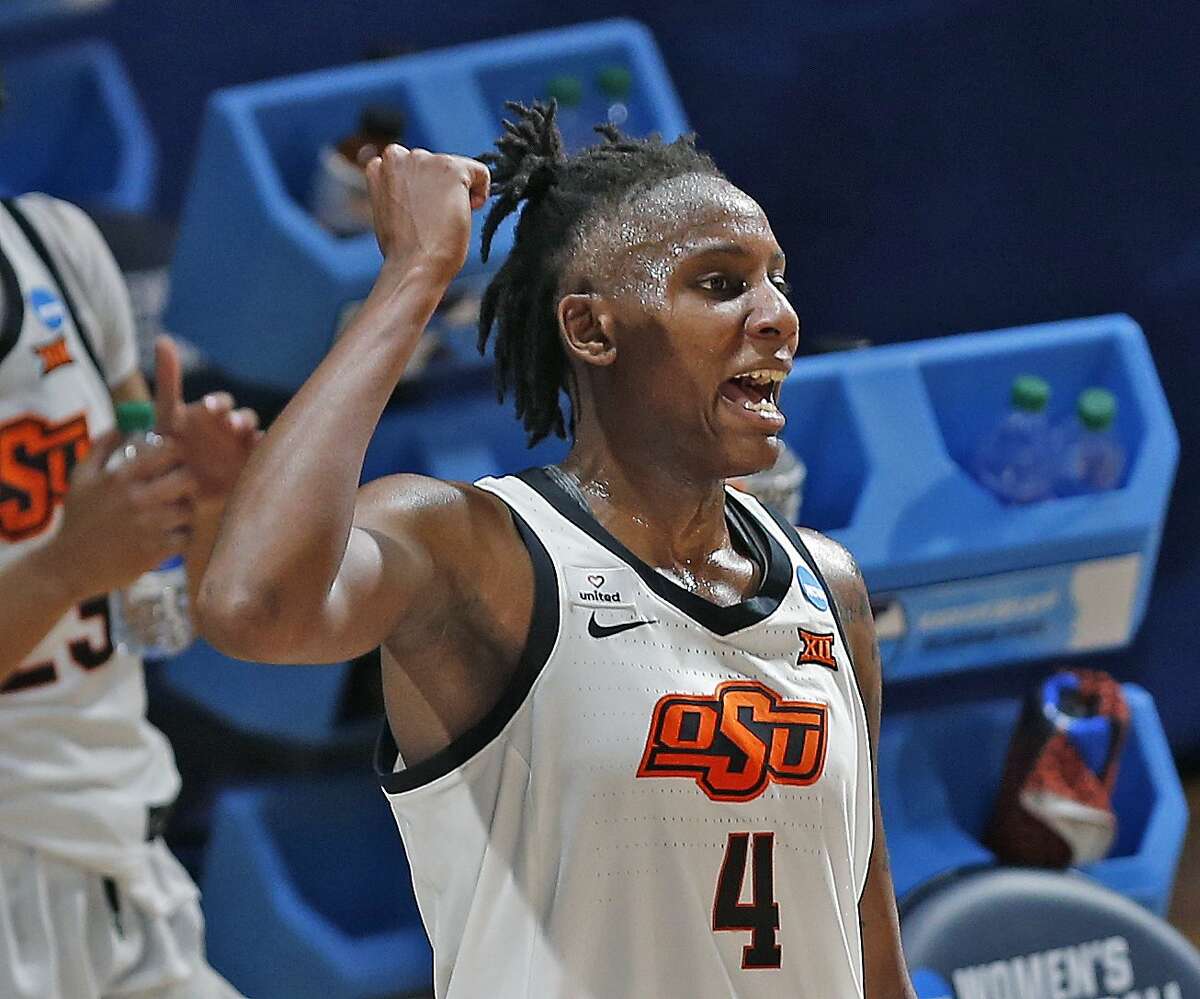 Oklahoma State forward Natasha Mack(4) celebrates as the clock ticks down during the second half of a college basketball game in the first round of the women's NCAA tournament at the Greehey Arena in San Antonio, Texas, Sunday, March 21, 2021. (AP Photo/Ronald Cortes)