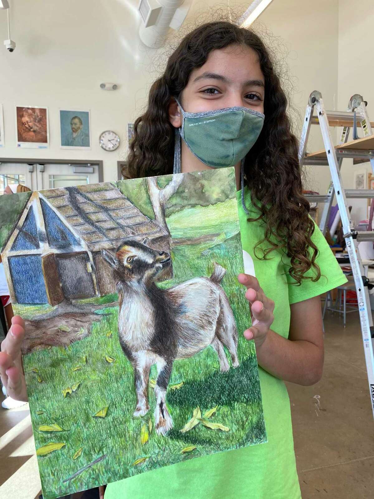 WIDE School sixth grader Luna Baba shows off her Best of Show piece from the rodeo art program.