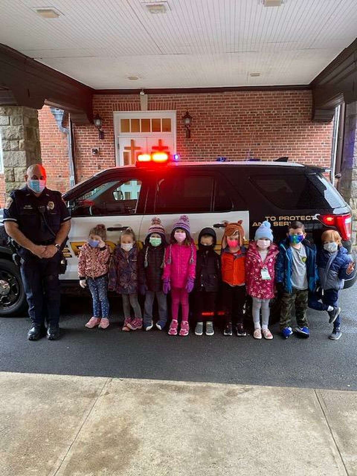 Ridgefield police officers talk safety with daycare students