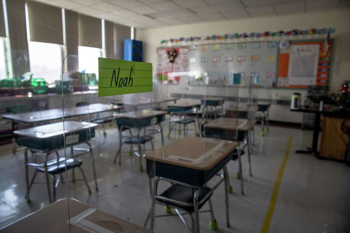 STAMFORD, CONNECTICUT - MARCH 10: Plastic dividers stand on classroom desks, due to pandemic protocols, before the first day of in-person learning for five days per week at Stark Elementary School on March 10, 2021 in Stamford, Connecticut. Stamford Public Schools, like many school districts nationwide, are returning to full time in-school learning as pandemic restrictions begin to ease. The district had been operating on a hybrid model for most of the school year. (Photo by John Moore/Getty Images)