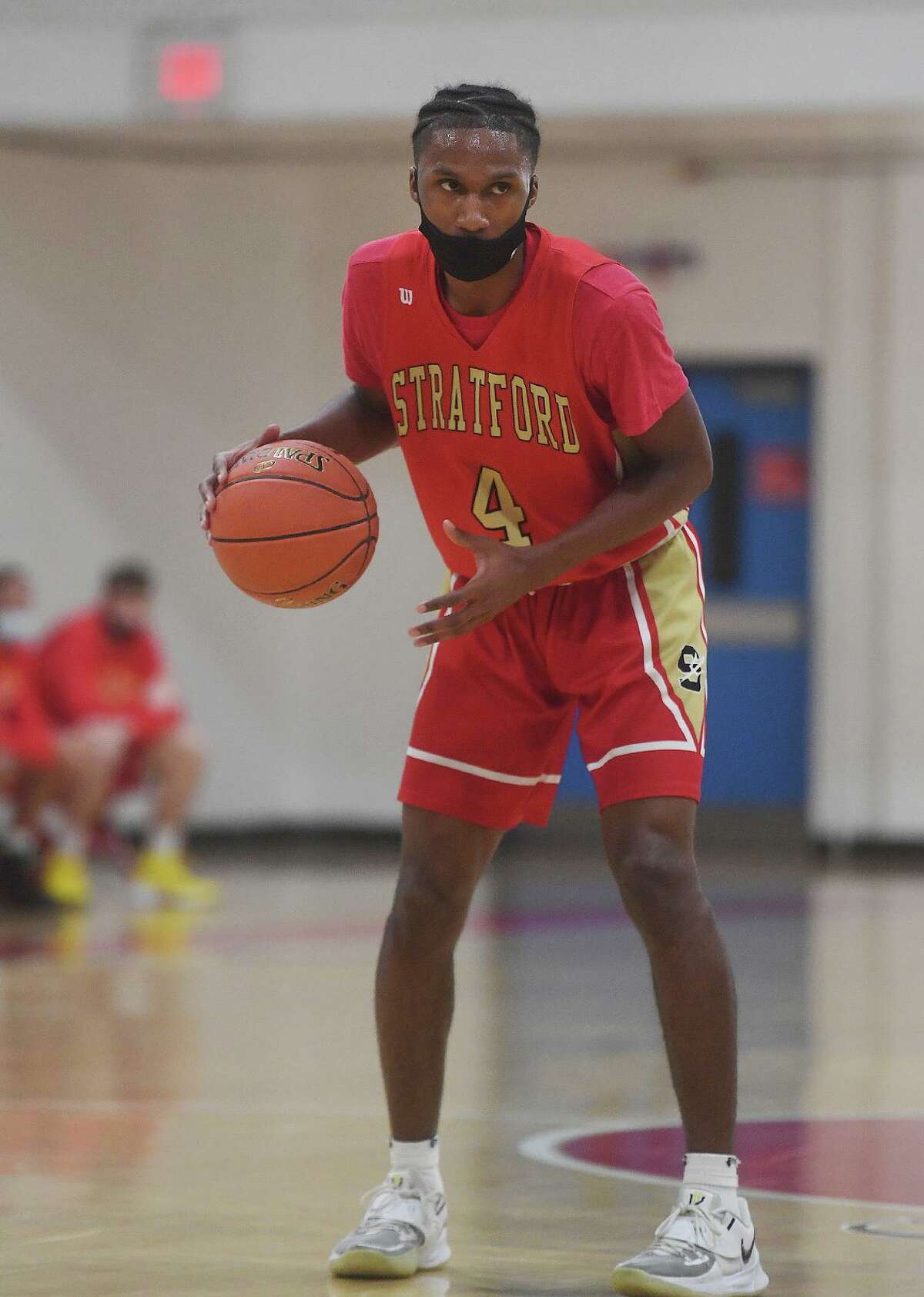 Stratford's Jayquan Kirkland handles the ball on the perimeter during the first half of their SWC tournament semifinal game against Kolbe Cathedral at the Cardinal Sheehan Center in Bridgeport, Conn. on Monday, March 22, 2021.